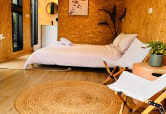 holiday tiny house near The Glen shopping center has Balcony rooms