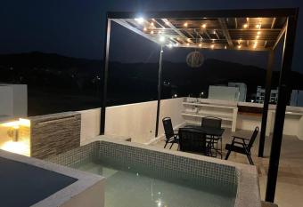 Penth house roof garden jacuzzi has rooms with a private hot tub