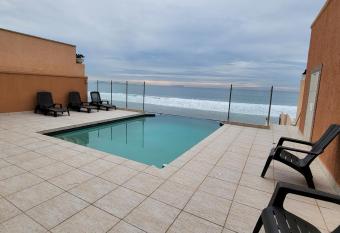 Oceanfront Condominiums with Private Beach Access has rooms with a private hot tub