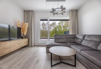 Cozy apartments in Mano J  ra2 has rooms with a private hot tub