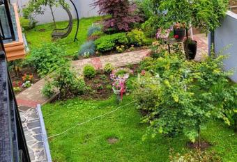 Green house has rooms with a private hot tub