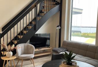 Beautiful loft apartment with glazed balcony has Balcony rooms