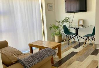 Cosy Apartment , 5 minutes drive to Strand Beach. has rooms with a private hot tub