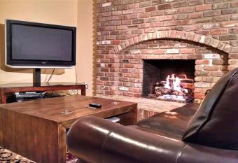 Entire Basement Suite, Cozy Fireplace, Dark Room, GREAT Location! allows 18 year olds to book a room