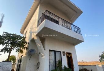Spanish-inspired 2 BHK White Villa - Brinla Homes allows 18 year olds to book a room