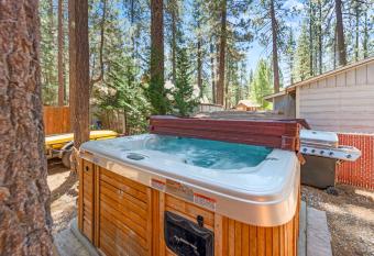 Romantic Getaway - Cozy and beautifully wooded getaway cabin with Hot Tub and a Fenced Yard! allows 18 year olds to book a room