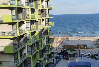 Alezzy Beach Family Studio has rooms with a private hot tub