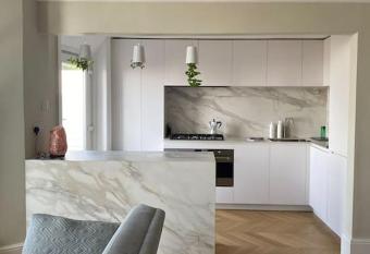 Modern, light, open plan apartment with sea view has Balcony rooms