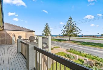 Beach Delight: A beach front home with scenic views has Balcony rooms