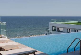 Infinity Pool Beach Resort Luxury Apartments and Spa has rooms with a private hot tub