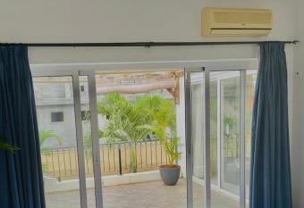 Guest room with balcony and bath in Flic en Flac has Balcony rooms