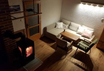 Rustical cottage with indoor fireplace has Balcony rooms