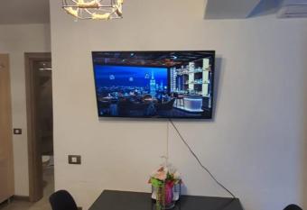 Alezzy SunSet View Beach Apartment has rooms with a private hot tub