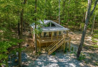 Coyote Cabin at Woodland Retreat at DeSoto beside DeSoto State Park has Balcony rooms