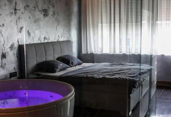 Beautiful Jacuzzi Apartment has rooms with a private hot tub
