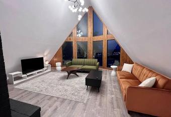 Unique 4Bed and 3Bath A-Frame has rooms with a private hot tub