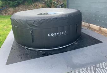 Dolafon farm luxury glamping cabin with hot tub has rooms with a private hot tub