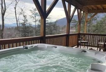 Above It All Hot Tub Views Rumbling Bald Sleeps 11 has rooms with a private hot tub