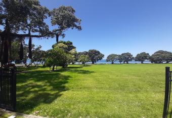 Ariki beachfront apartment has rooms with a private hot tub