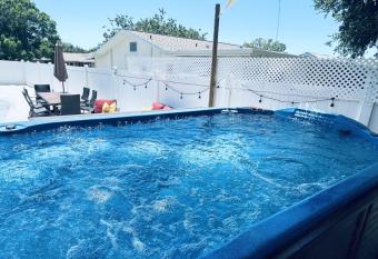 Beach Resort Retreat Swim Jacuzzi Accessible Home has rooms with a private hot tub