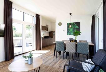 Luxury chalet with outdoor sauna and spa, on a holiday park, Den Bosch at 22 km has rooms with a private hot tub