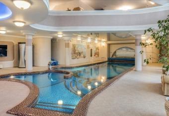 Villa with pool and garden has rooms with a private hot tub