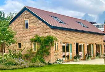 The Pool House has rooms with a private hot tub