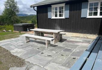 Cozy family friendly cabin at beautiful location! has rooms with a private hot tub