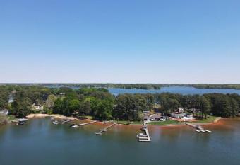 Waterfront LKN Sunset view home has rooms with a private hot tub