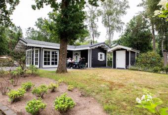 Comfortable chalet with combi microwave, in a holiday park near De Veluwe has Balcony rooms