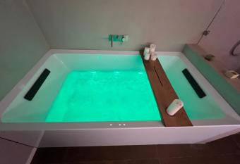 Design Suite with Private Jacuzzi and Pool Table has rooms with a private hot tub