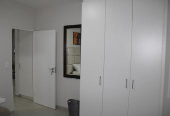 Fun modern two bed apartment in fourways has Balcony rooms