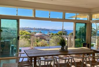 Large luxury house with stunning beach views has rooms with a private hot tub