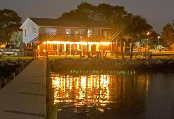 Waterfront home, dock, hot tub, playhouse, large fenced yard, near beach has rooms with a private hot tub