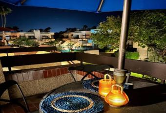 Cozy Palm Springs Condo has rooms with a private hot tub