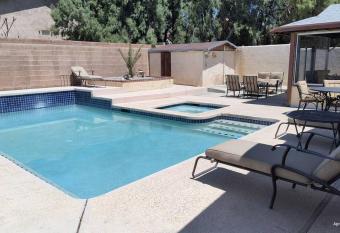 Beautiful Home with a Relaxing Pool Area has rooms with a private hot tub