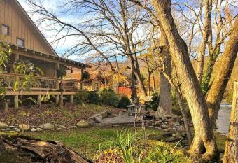 Water's Edge ~ Covered Porch w/ Deep Creek as your Backyard Haven has rooms with a private hot tub
