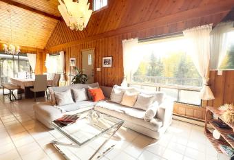 Bright & Large Chalet in St-Adele For 10 w Hot Tub has rooms with a private hot tub