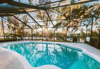 Luxury Waterfront Home with Pool. Minutes to Sanibel allows 18 year olds to book a room