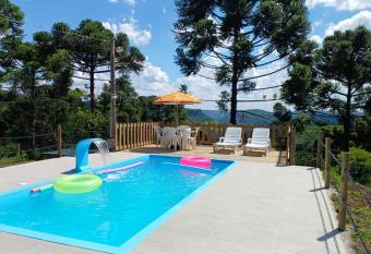 Casa aconchegante em meio a natureza has Balcony rooms