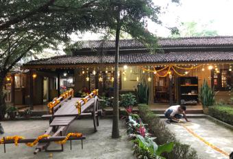 Tharu Community Home Stay has rooms with a private hot tub