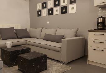 Square Apartments has rooms with a private hot tub