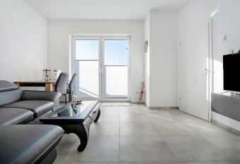 Neubau Ferienwohnung mit Balkon has Balcony rooms