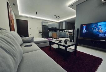 Opulent Cozy Apartment has rooms with a private hot tub