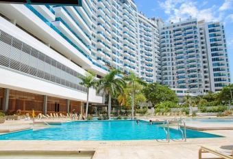 Exclusivo Apto en club con playa has rooms with a private hot tub