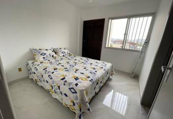 Quarto e sala 100 mts da praia allows 18 year olds to book a room