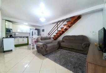 Casa nova no Booking, no cora    o da Meia Praia. has Balcony rooms