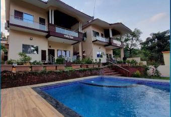 Rhythm Villa (10BHK Villa with private pool) has rooms with a private hot tub