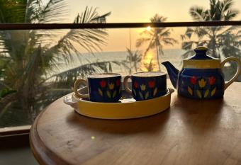 Sunset and Palm trees - An Airport Boutique by the Sea has Balcony rooms