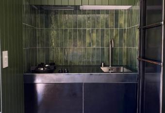 The Box Car with Outdoor Private Bath has rooms with a private hot tub